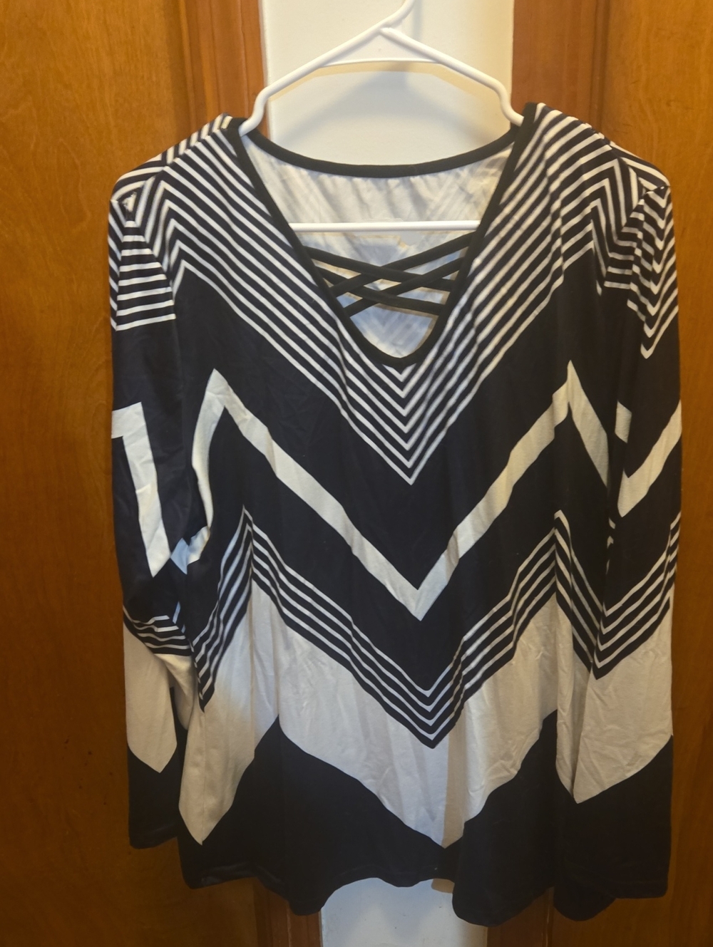 Women’s Black and White Chevron Striped Long Sleeve Top with Crisscross Neck